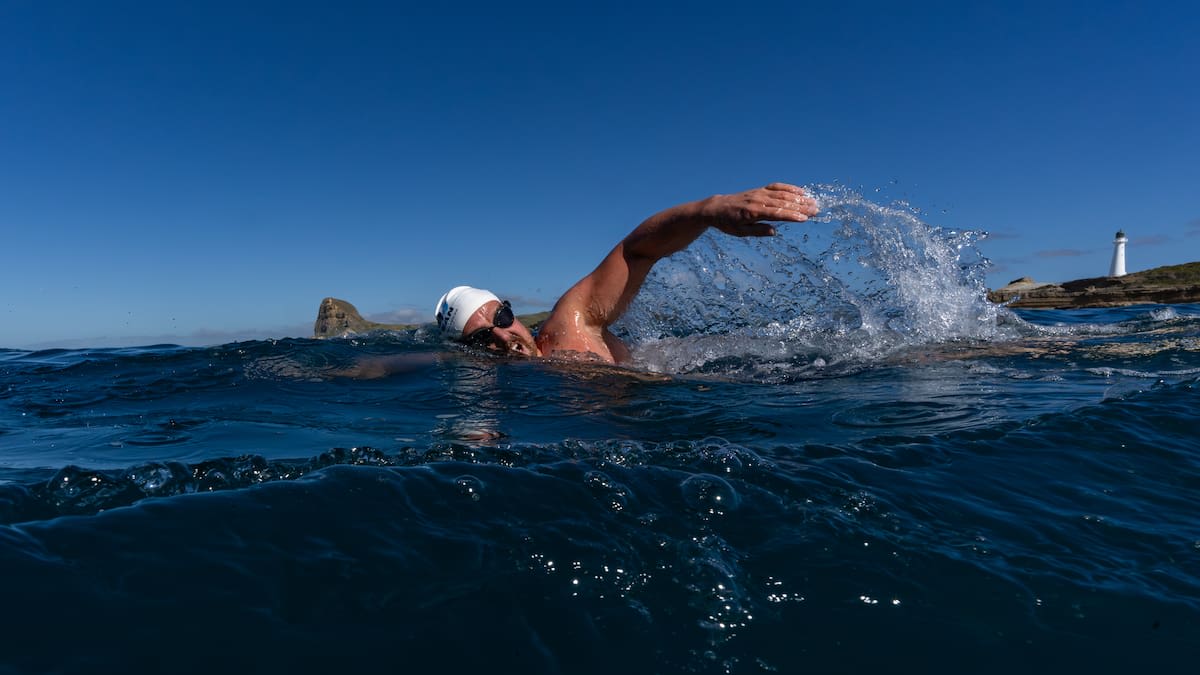 Ocean swimmer Jono Ridler in water during his record-breaking swim along New Zealand's coast