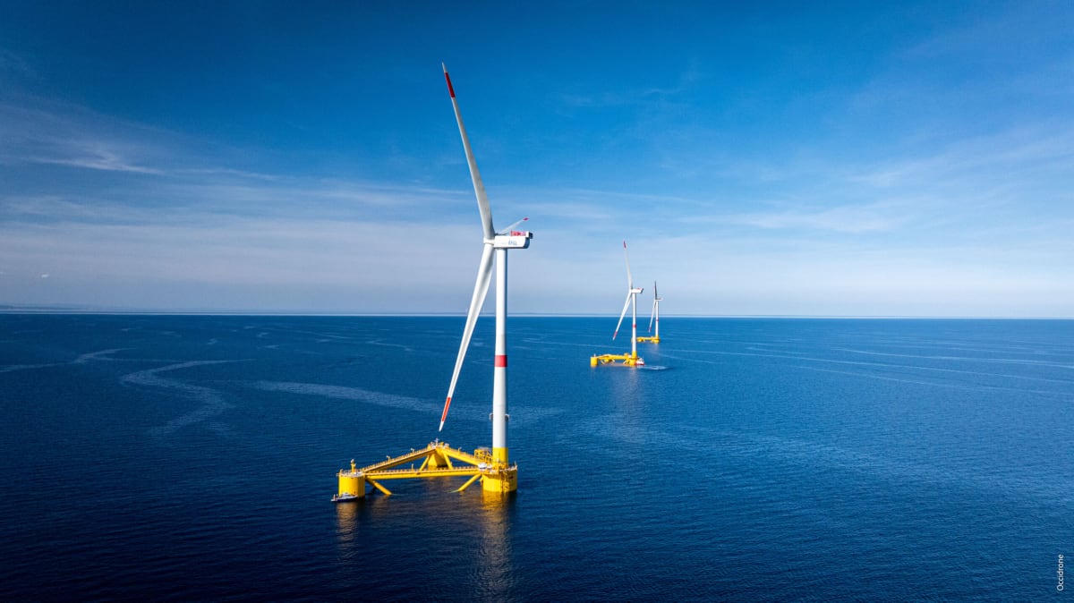 Floating offshore wind turbines generating clean renewable energy on ocean waters near France