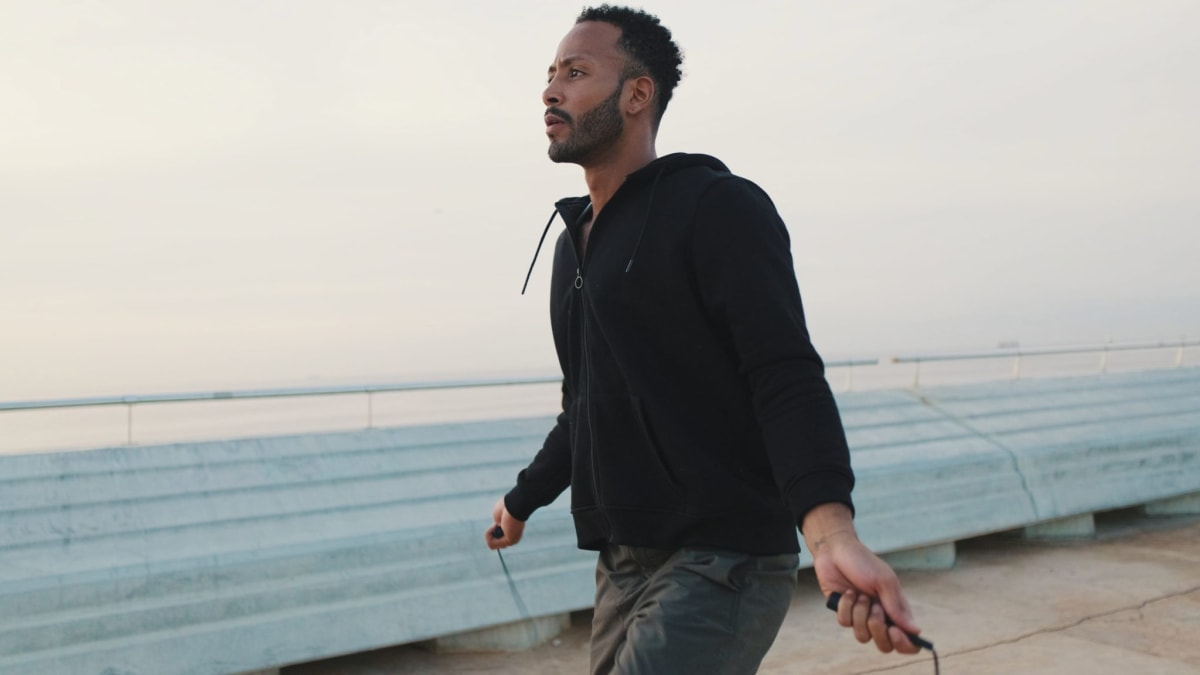 Active person exercising outdoors representing the science-backed benefits of physical movement and metabolism