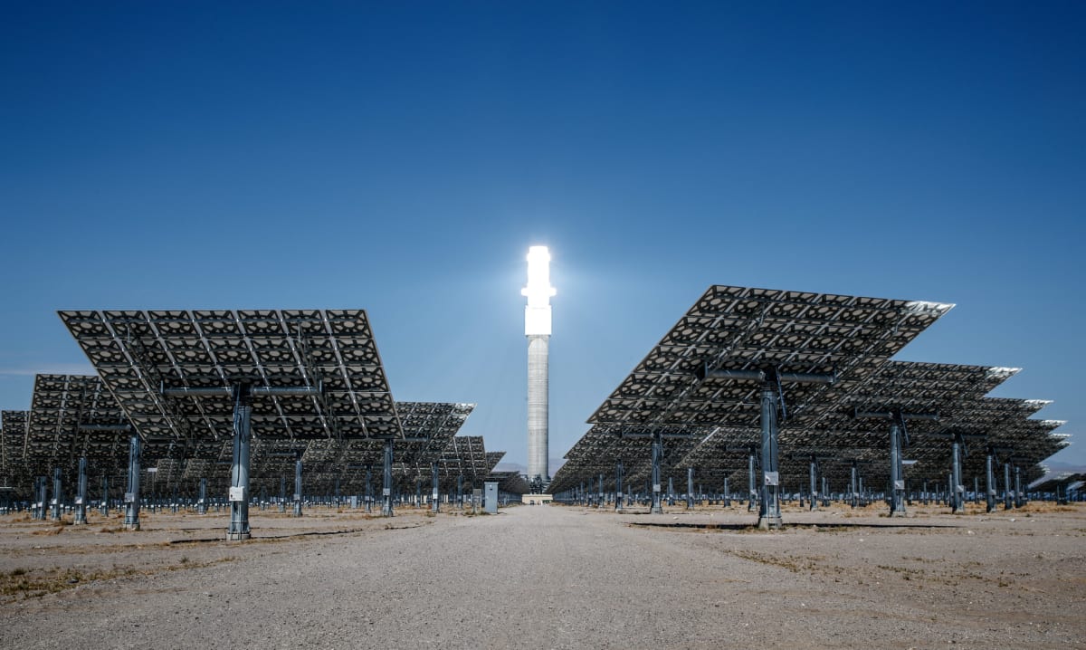 Industrial facility with large insulated tanks storing liquid air for clean energy grid storage
