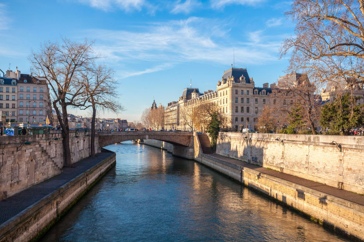 Underground pipes carrying cooling water beneath Paris streets with Seine River in background