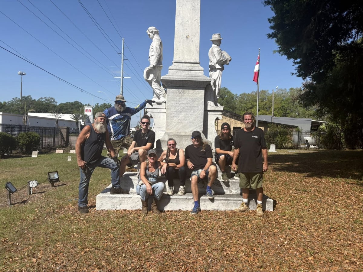 Volunteers from Brandon Roots Group cleaning and restoring historic cemetery grounds in Florida