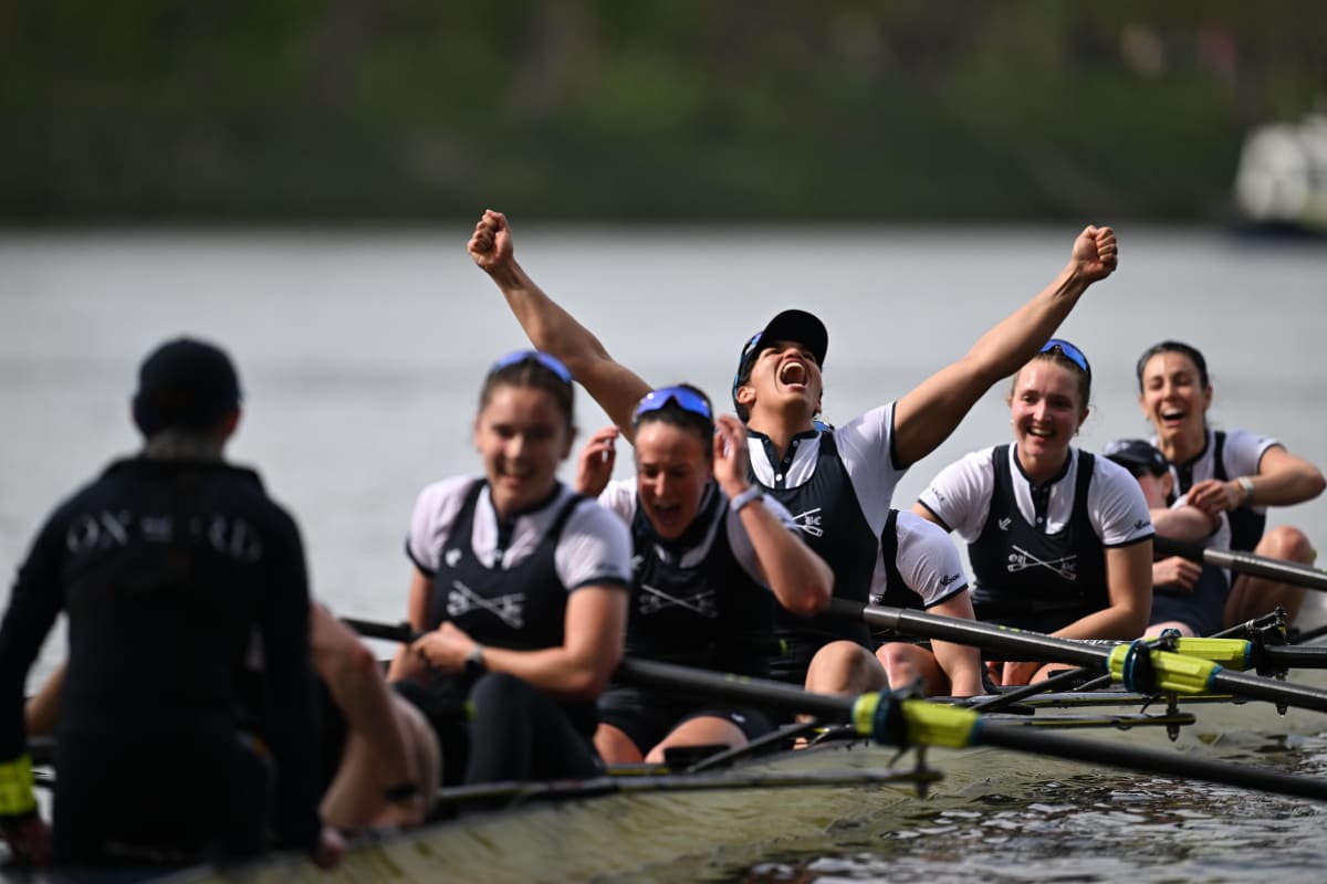 Oxford women's rowing crew celebrating victory on the Thames after winning the 80th Boat Race