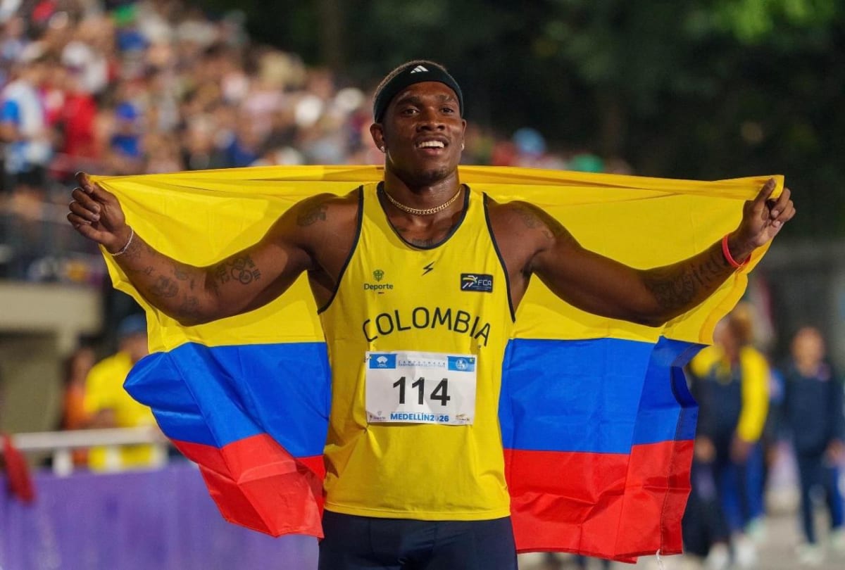 Colombian sprinter Ronal Longa celebrates after breaking South American 100 meter record at home stadium