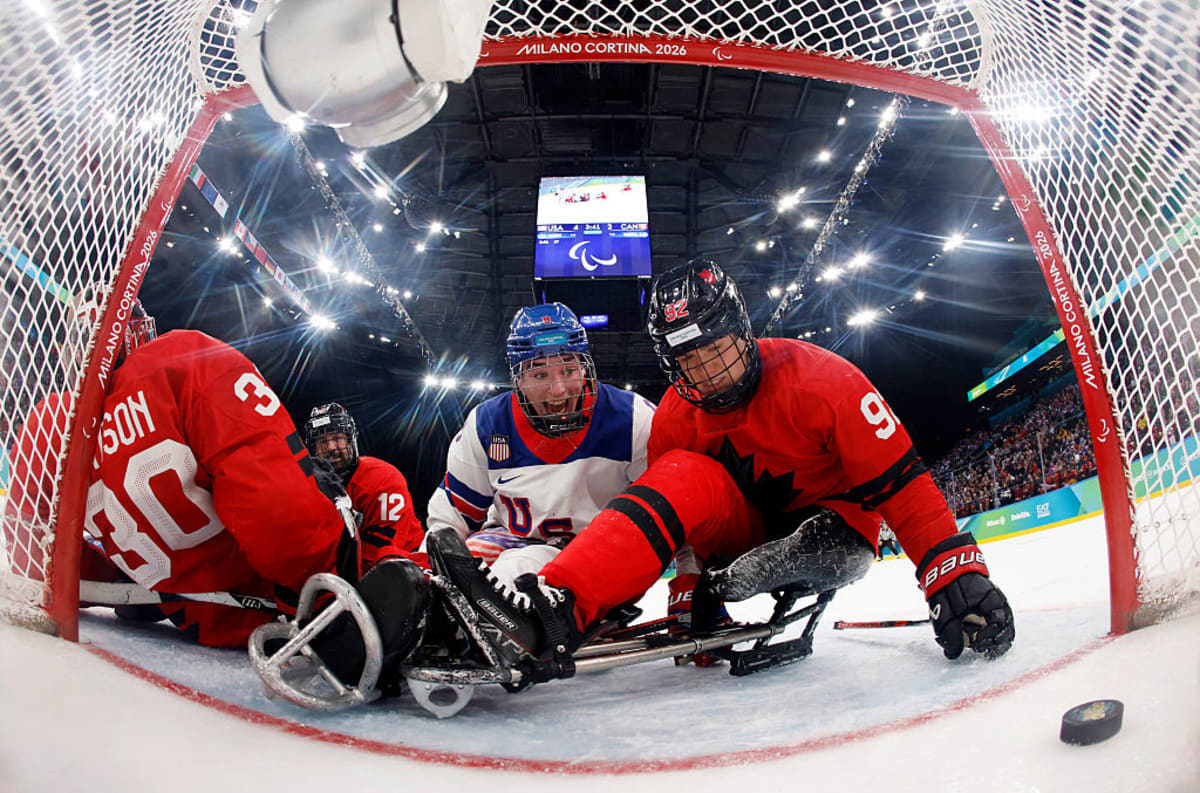 Jack Wallace celebrates scoring a goal for Team USA during Paralympic ice hockey gold medal game