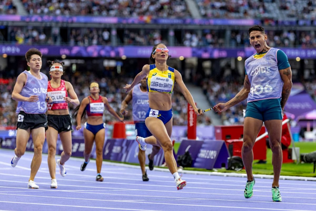 Para athletes competing on track at modern stadium during World Para Athletics competition
