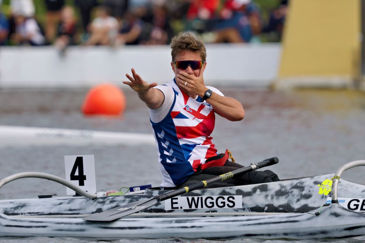 Emma Wiggs celebrating in her canoe after winning her 13th world championship title in Poland