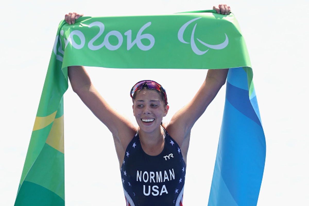 Grace Norman celebrating with arms raised after winning first Paralympic gold medal in Rio