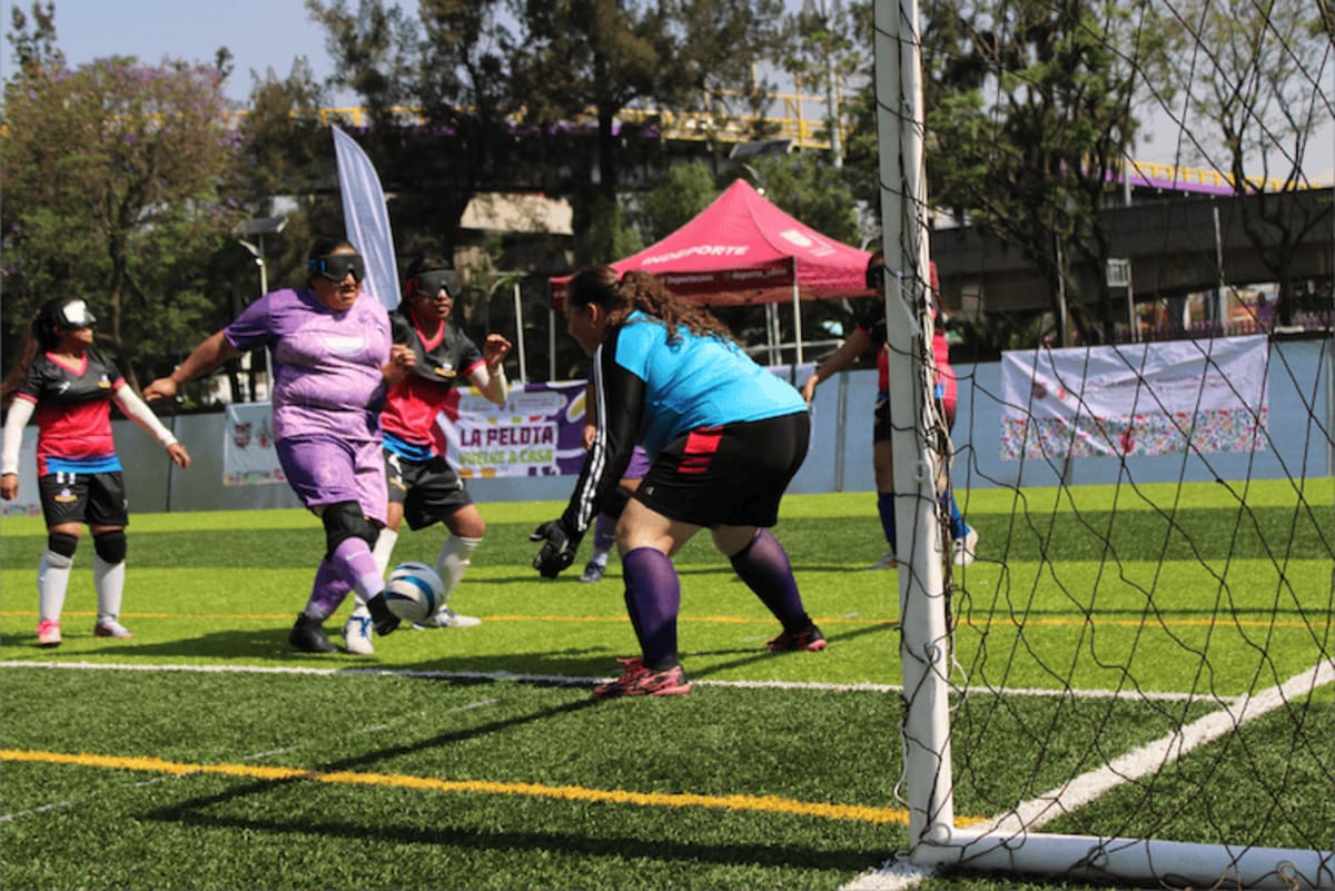 Visually impaired women playing five-a-side football wearing blackout eye coverings in Mexico City