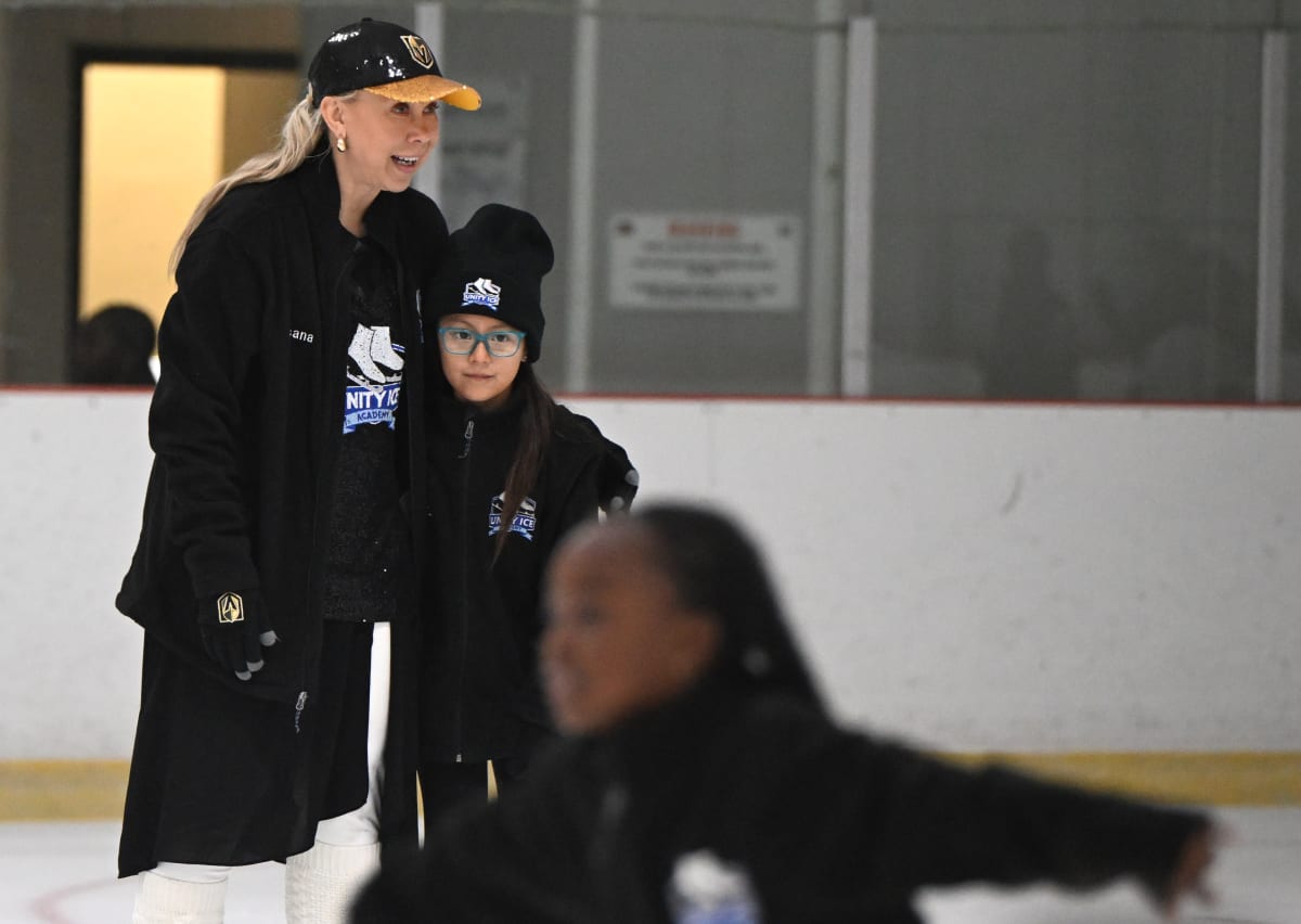 Olympic gold medalist Oksana Baiul coaching eight-year-old Zoe Rodriguez at ice skating camp in Lakewood