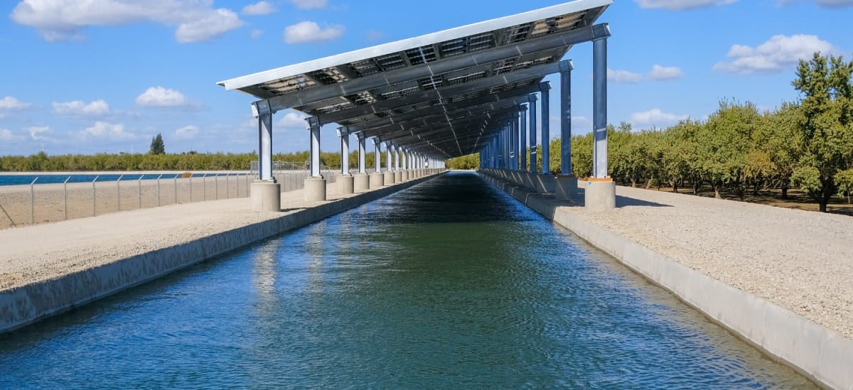 Solar panels installed vertically along European highway corridor generating clean renewable energy