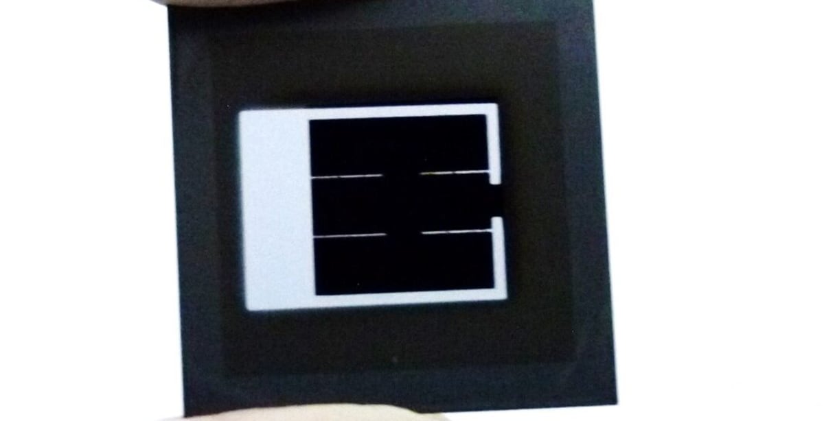 Modern solar panel cells gleaming in sunlight at manufacturing facility