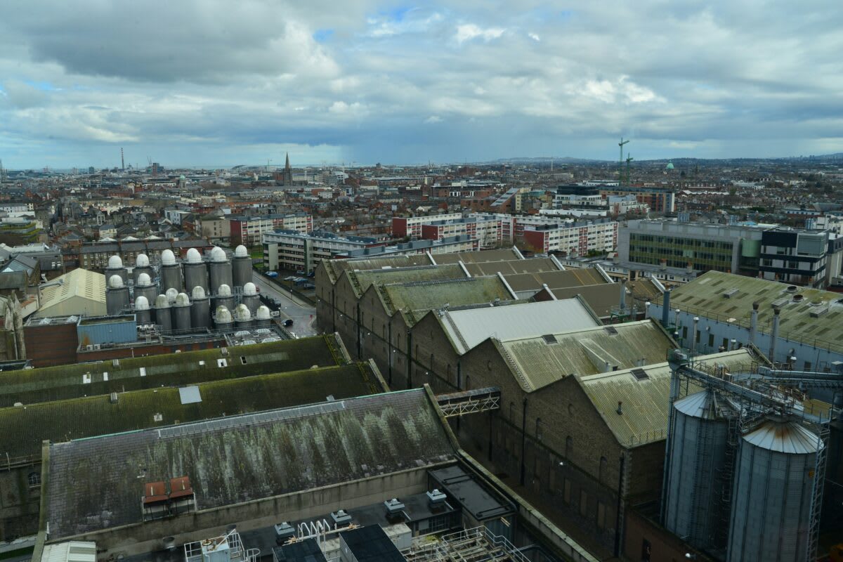 Solar panels installed on residential rooftop in Ireland under partly cloudy sky
