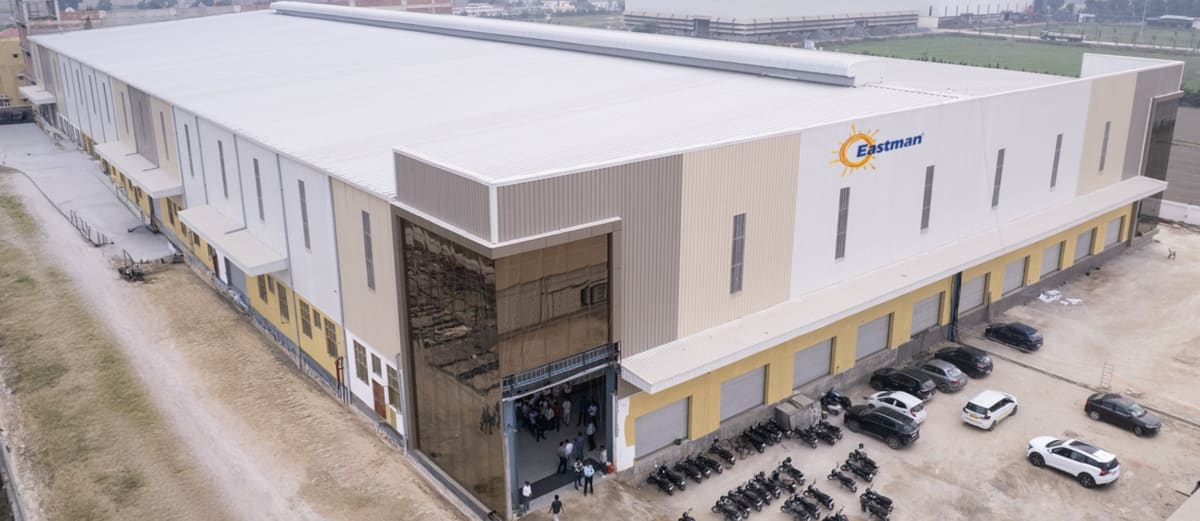 Modern solar panel manufacturing facility in India with rows of photovoltaic modules