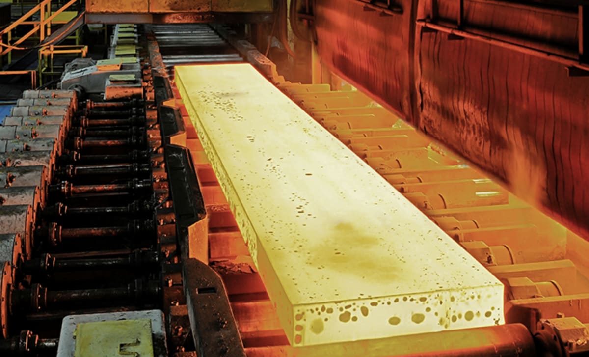 Modern industrial facility with renewable energy infrastructure under bright Australian sky