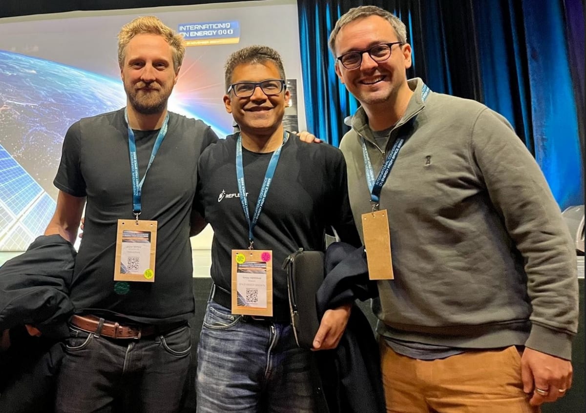 Conceptual illustration of satellite transmitting solar power wirelessly through space using radio waves