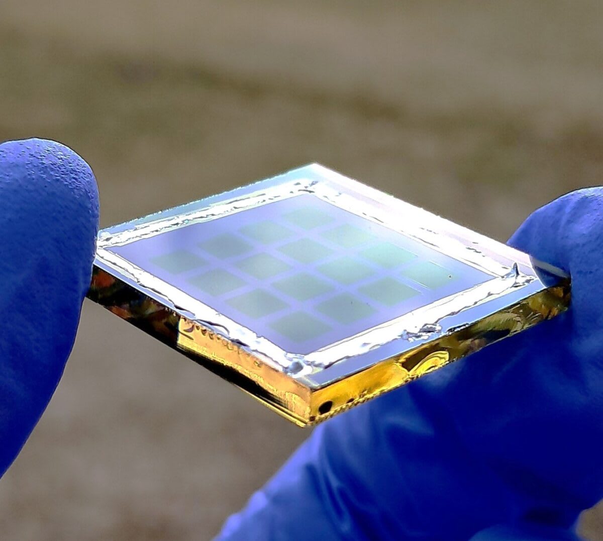 Close-up view of transparent bifacial solar cell panel capturing sunlight from multiple angles