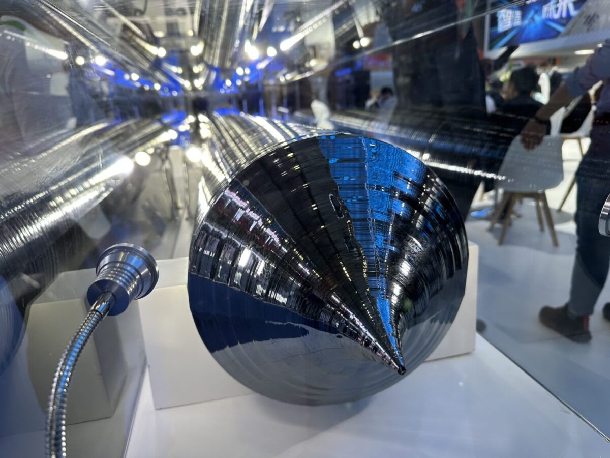 Solar panel manufacturing facility with workers assembling photovoltaic components in modern Indian factory