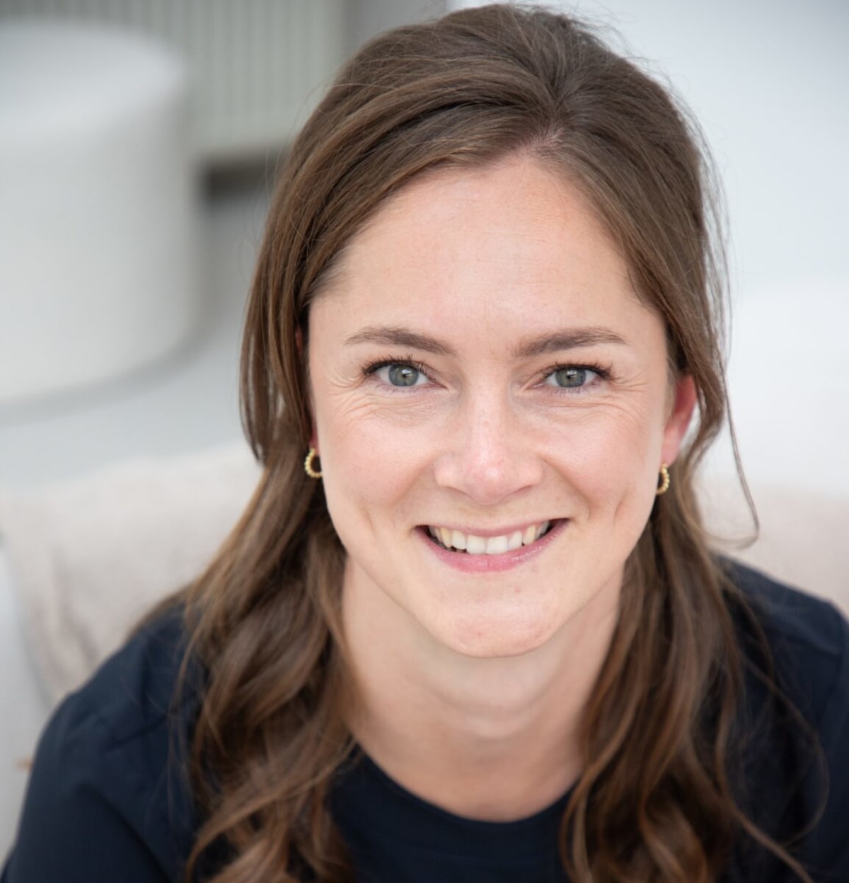 Professional woman leading meeting in modern solar energy company office environment