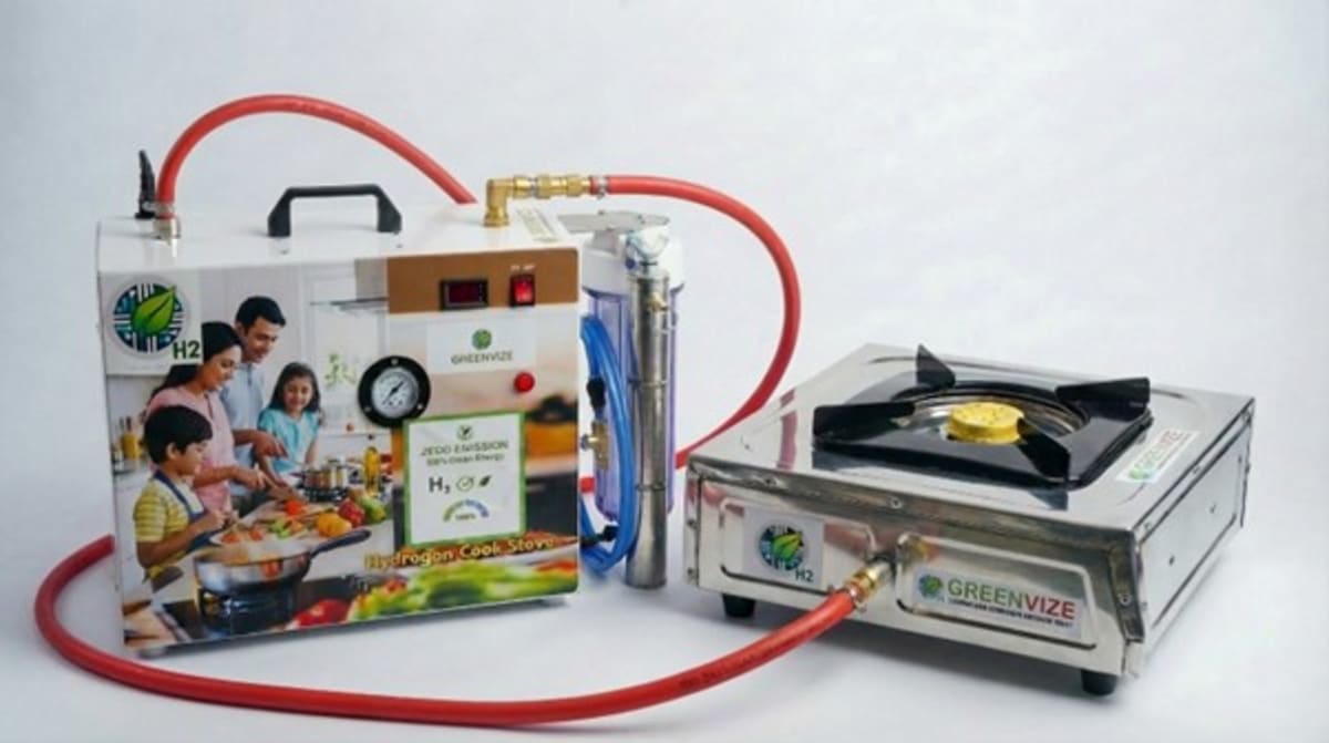 Compact hydrogen cooking stove generating clean fuel from water on kitchen counter