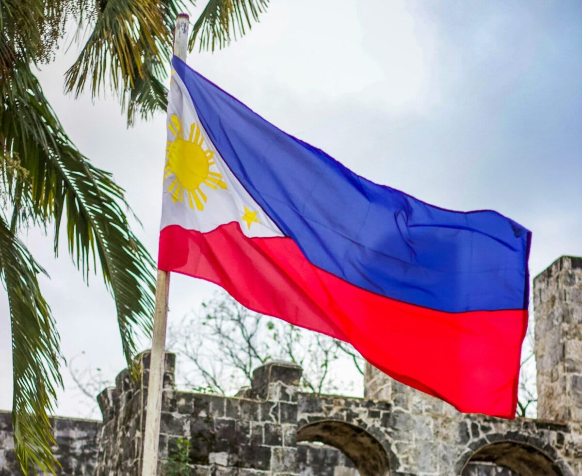 Solar panels installed on residential rooftop in the Philippines under bright tropical sunlight