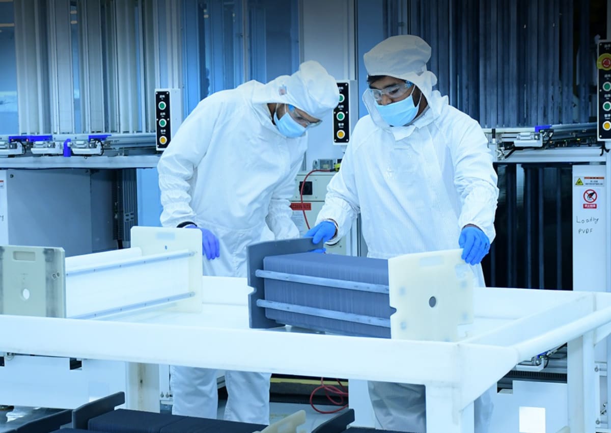 Modern solar cell manufacturing facility with rows of photovoltaic panels in production in India