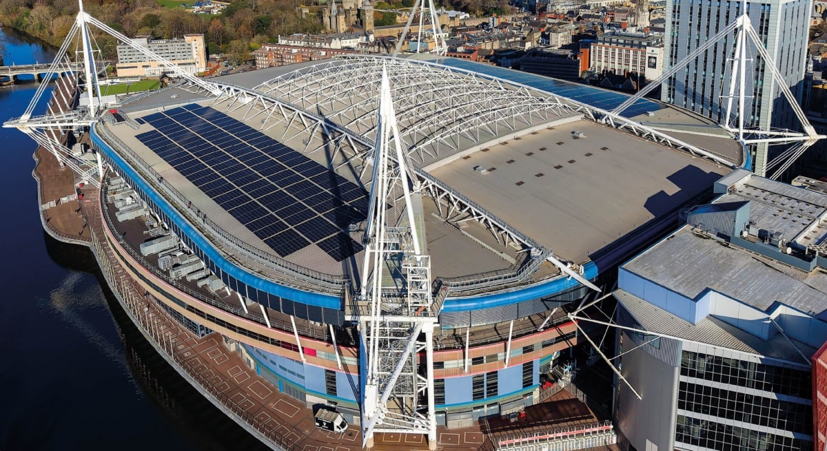 Aerial view of Cardiff's Principality Stadium with thousands of solar panels covering its retractable roof