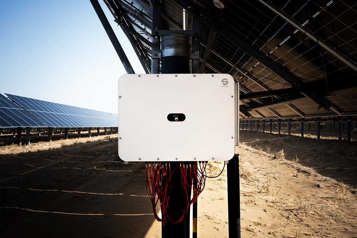 Large-scale solar panel array with advanced inverter equipment converting sunlight to grid power