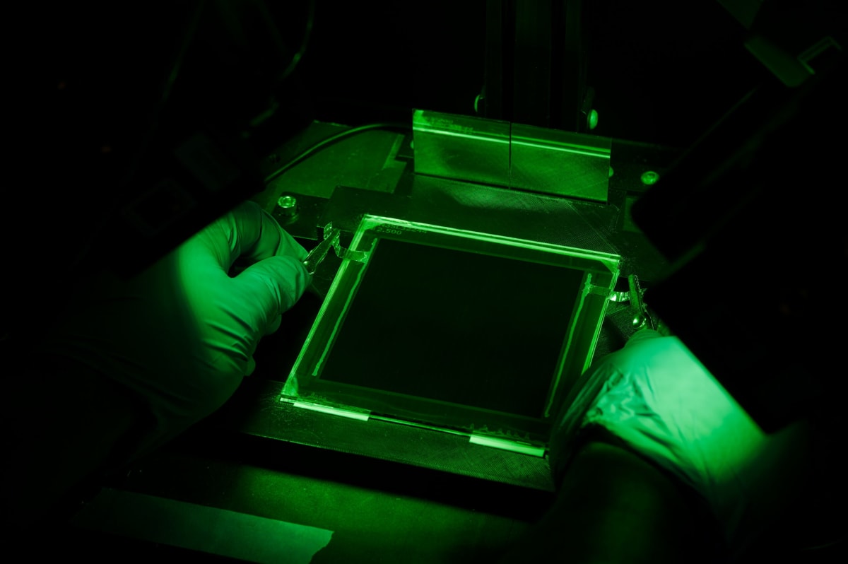 Close-up of advanced solar panel with layered perovskite and silicon technology reflecting sunlight