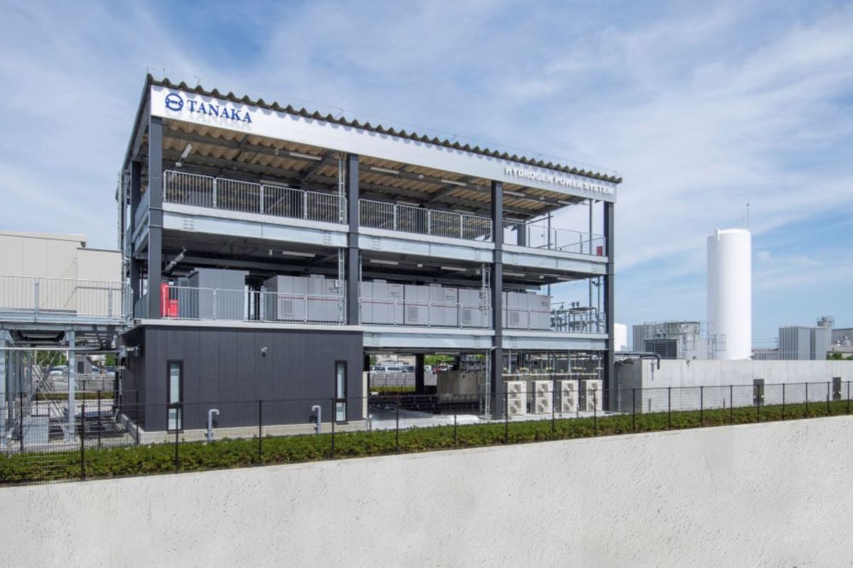 Modern hydrogen fuel cell power generation facility at industrial plant in coastal Japan