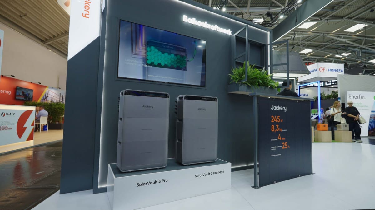 ** Modern home solar energy storage system with smart monitoring display showing power optimization