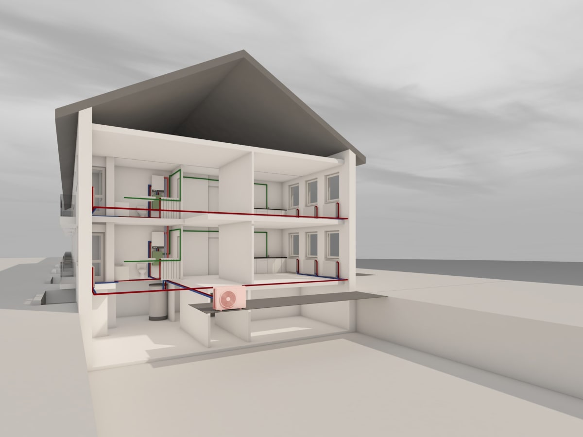 Modern heat pump unit installed on exterior wall of multi-story apartment building
