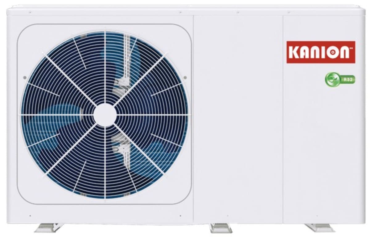 Modern outdoor heat pump unit mounted outside residential building with protective fins