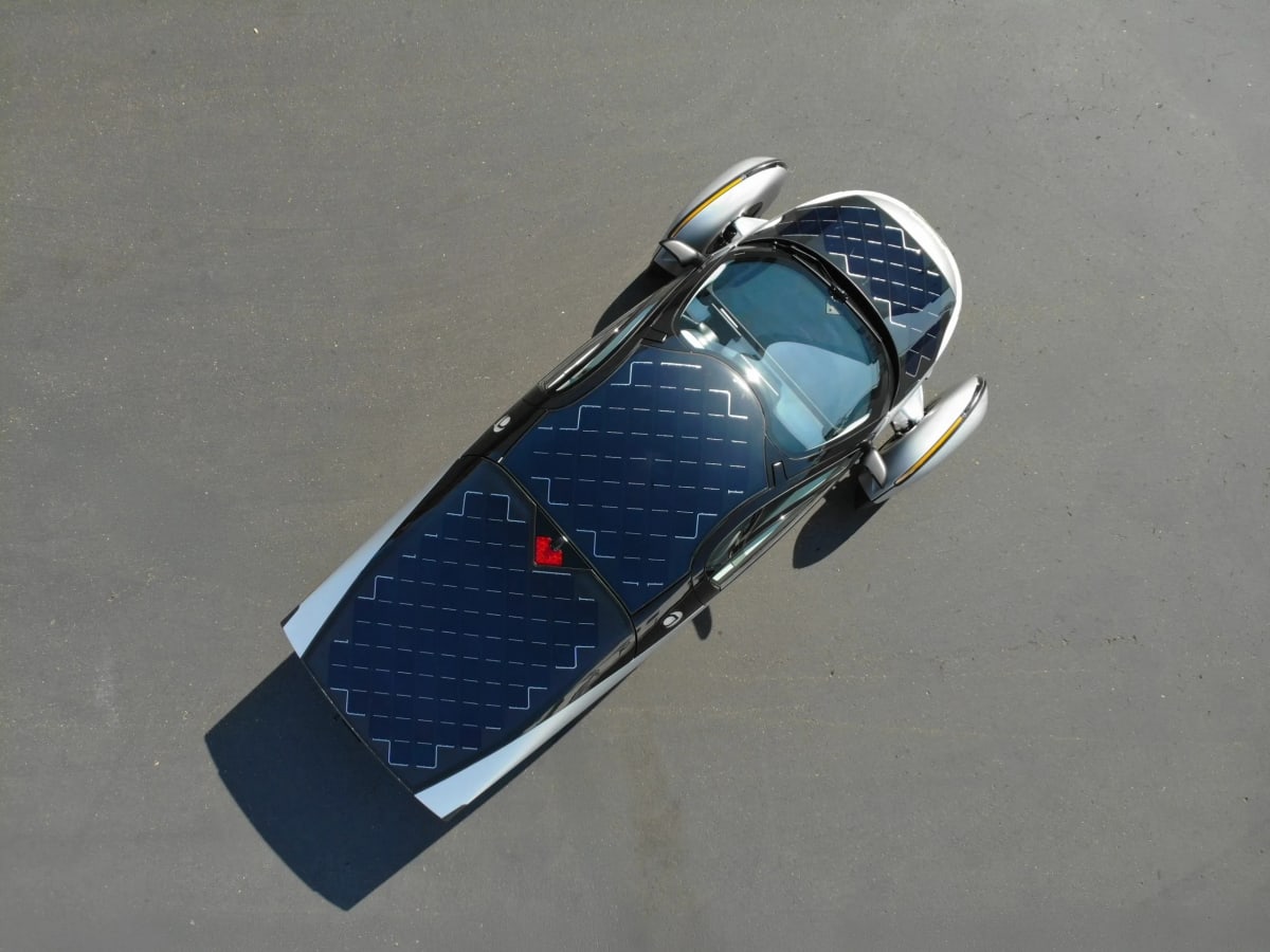 Aptera solar electric vehicle with integrated photovoltaic panels across body generating clean energy