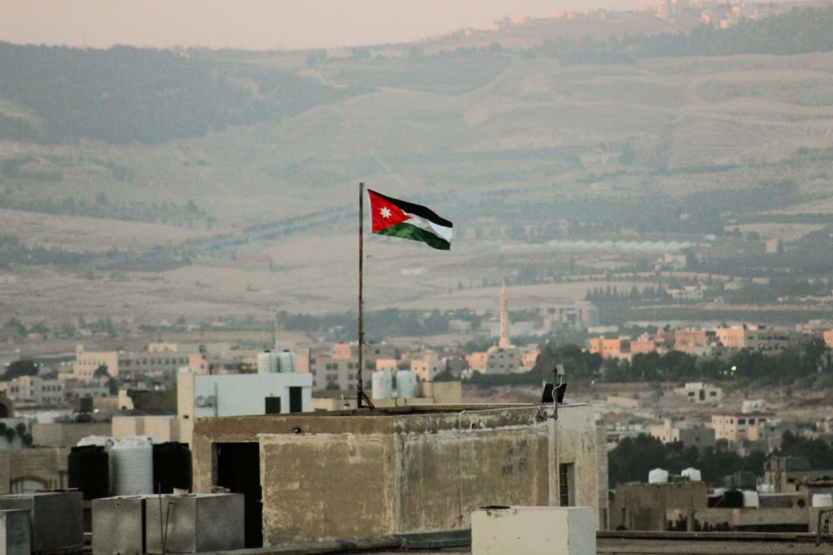 Solar panels installed on residential rooftops in Jordan under bright Middle Eastern sunshine