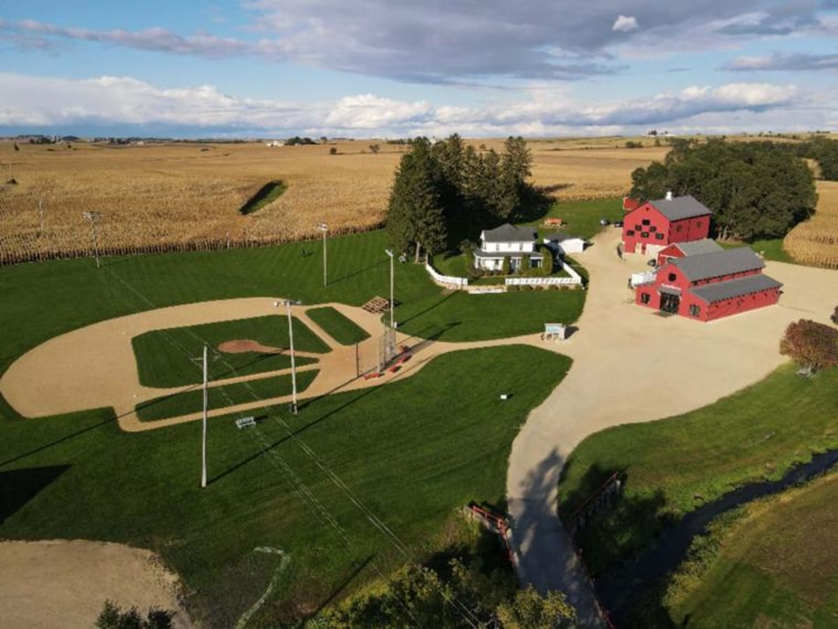 Baseball players on historic Field of Dreams diamond celebrating organ donation awareness