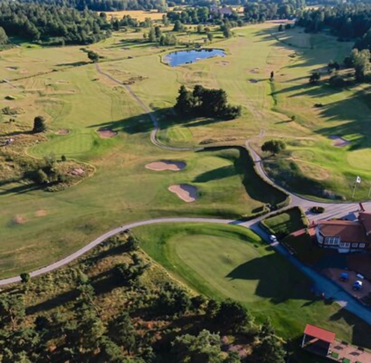 Solar panel covered parking structure with electric vehicle charging stations at Swedish golf club