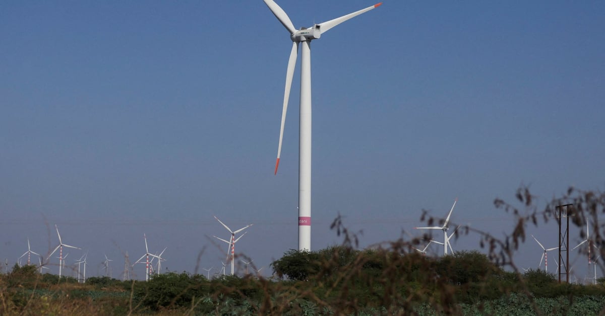 Wind turbines spinning at Adani Green Energy wind farm in Gujarat, India