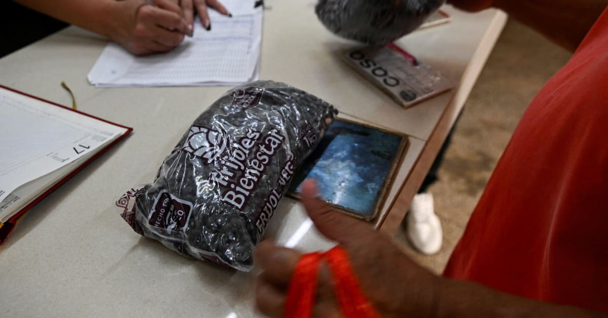 Volunteers loading boxes of donated supplies onto boats at a Mexican port