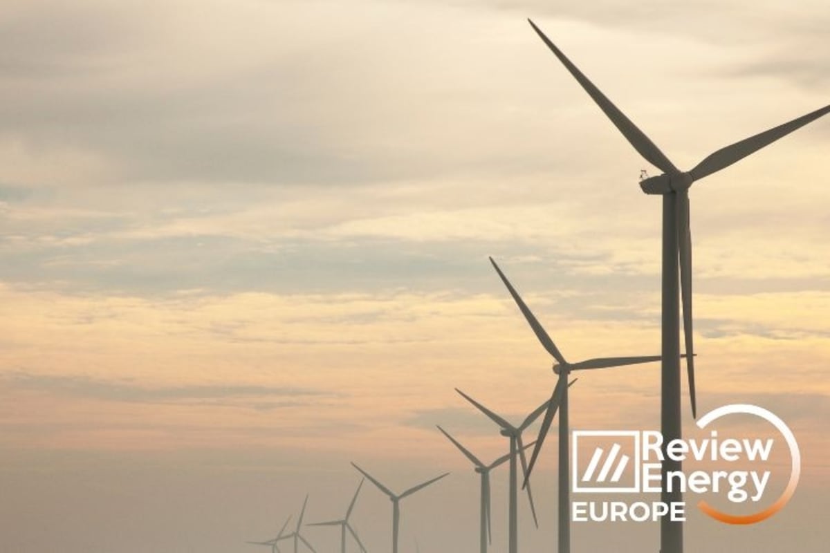 Wind turbines standing tall against Finnish sky generating clean renewable electricity for Google data centers