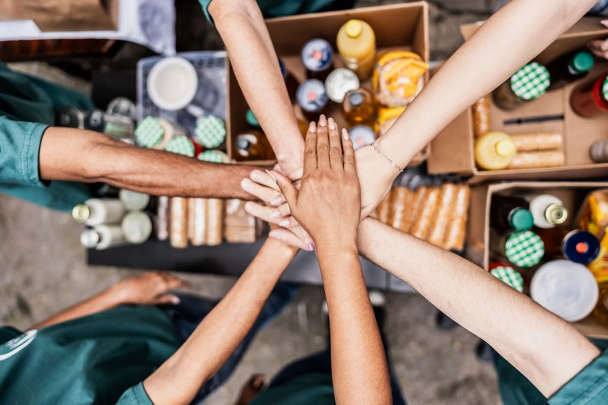 ** Real estate professionals celebrating charitable donation to Southern Nevada community organizations