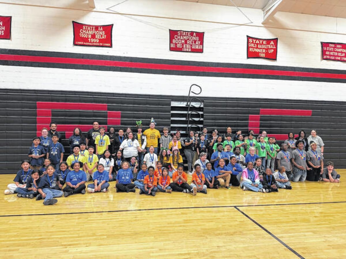 Students gathered around robotics displays at Robeson County school competition in North Carolina