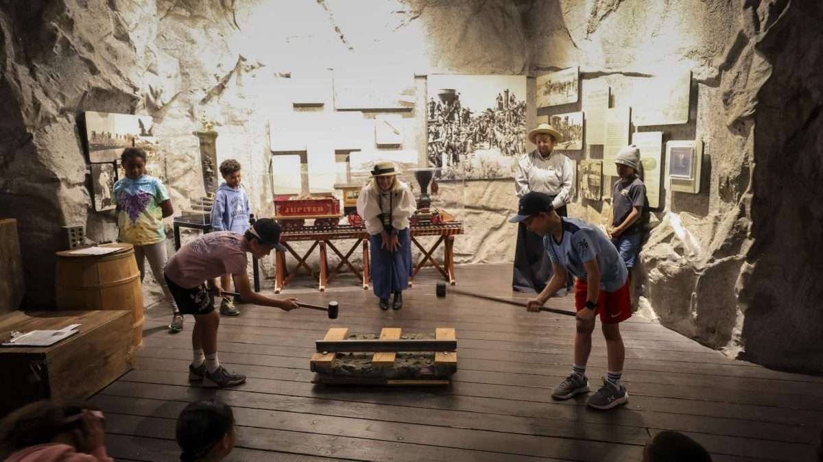 Visitors exploring historic train exhibits at California State Railroad Museum in Sacramento