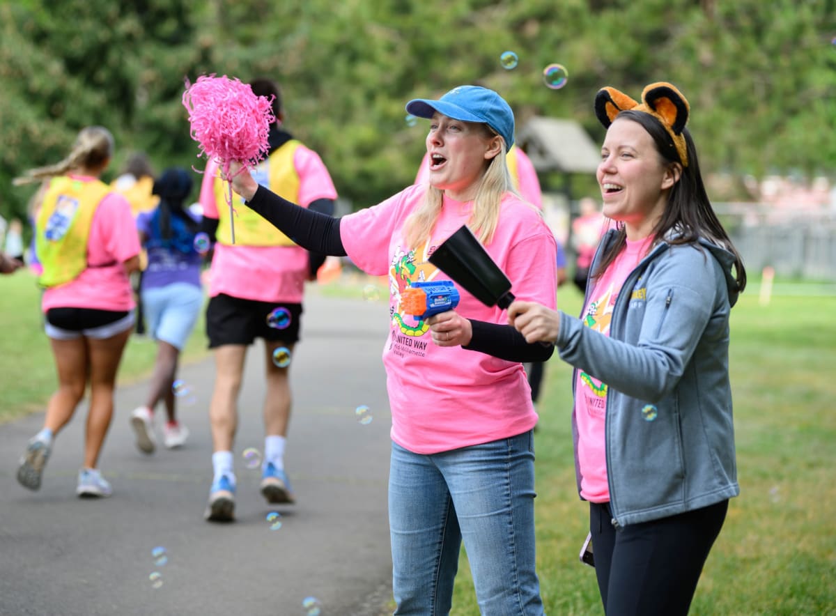 Young runners racing through Bush's Pasture Park during Awesome 3000 fun run event