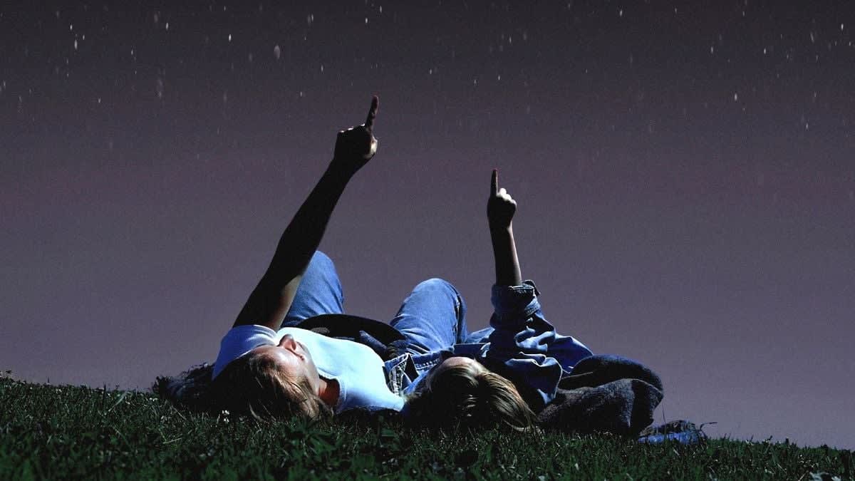 Bright meteor streaks across dark starry night sky during annual Lyrid shower