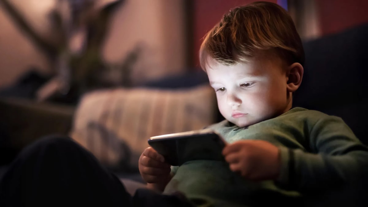 Teenager using tablet computer for educational activities while sitting at desk