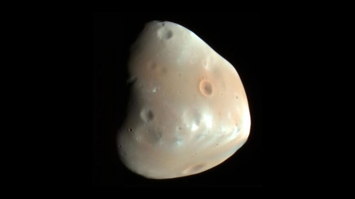 One Asteroid Strike Solved Two Mysteries on Mars Moon