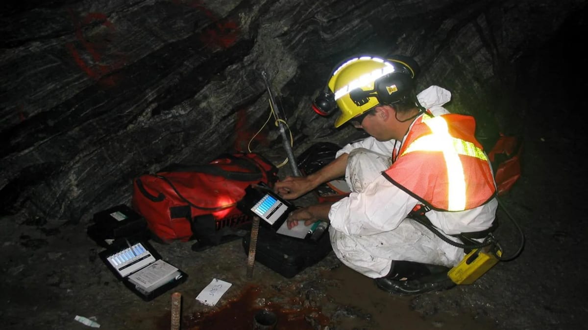 Underground mine borehole equipment measuring natural hydrogen gas flowing from ancient Canadian rock formations