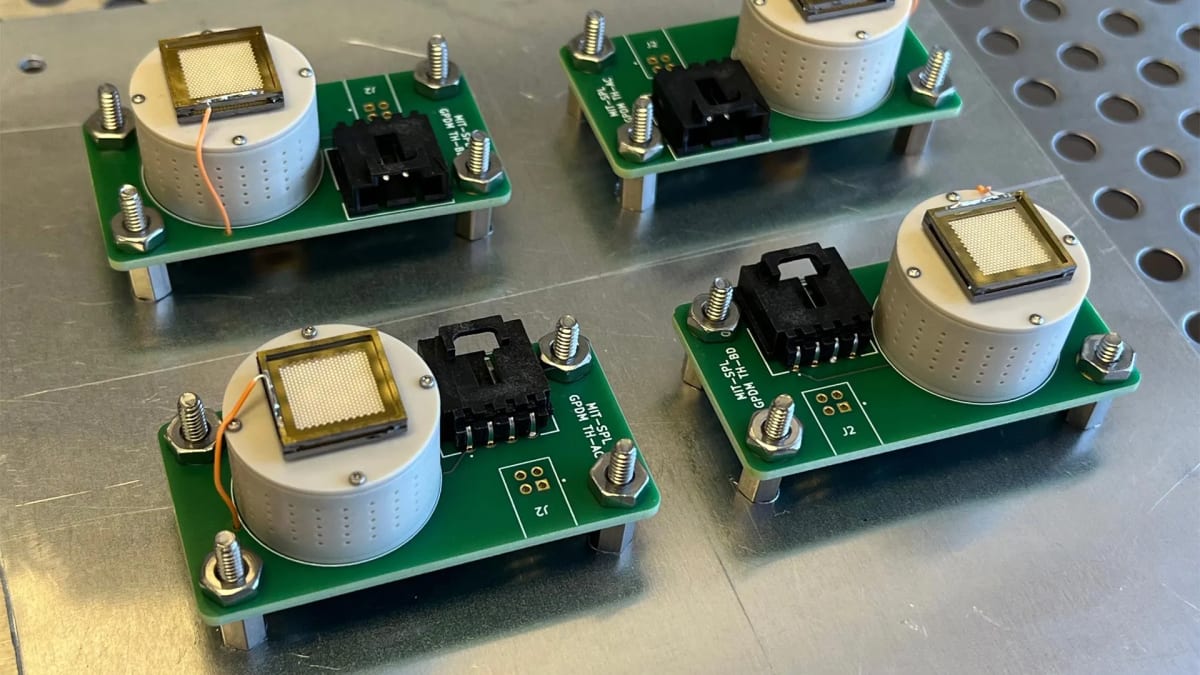 Four thumbnail-sized electrospray thrusters developed at MIT Space Propulsion Laboratory for NASA mission