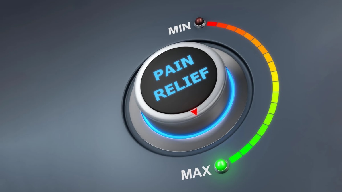 Scientist examining brain scan imagery showing targeted pain-processing neural pathways and circuits